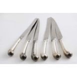 A SET OF SIX GEORGE II SIDE KNIVES with leaf-capped, pistol handles and later stainless steel