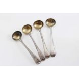 A SET OF FOUR VICTORIAN OLD ENGLISH BEAD PATTERN SALT SPOONS with gilt bowls, crested and