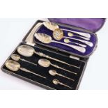 A CASED SET OF SIX GRADUATED SILVERGILT COPIES OF THE CORONATION ANNOINTING SPOON, maker's mark "