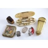 A MIXED LOT:- An 18th century gilt-metal etui case, a Victorian gilt-metal mounted needle case, a