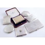 THREE CIGARETTE CASES A gold-faced cigarette case (in a box) and three powder compacts (one with the