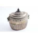 A VICTORIAN PART-FLUTED OVAL TEA CADDY with twin, lion mask & drop-ring handles, engraved borders