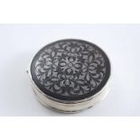 AN EARLY 18TH CENTURY CIRCULAR SNUFF BOX with a mounted tortoiseshell cover & base and a "stand-