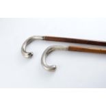 AN EARLY 20TH CENTURY SWEDISH SILVER MOUNTED WALKING STICK with a malacca shaft & a crook handle,