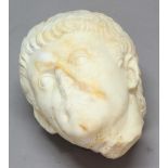 AFTER THE ANTIQUE: Head of a Man, possibly Roman, white marble with yellow striations, height 25cm