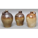 THREE STONEWARE BROWN-GLAZED WINE JARS, 17th/18th century and later, height of tallest 40cm (3)