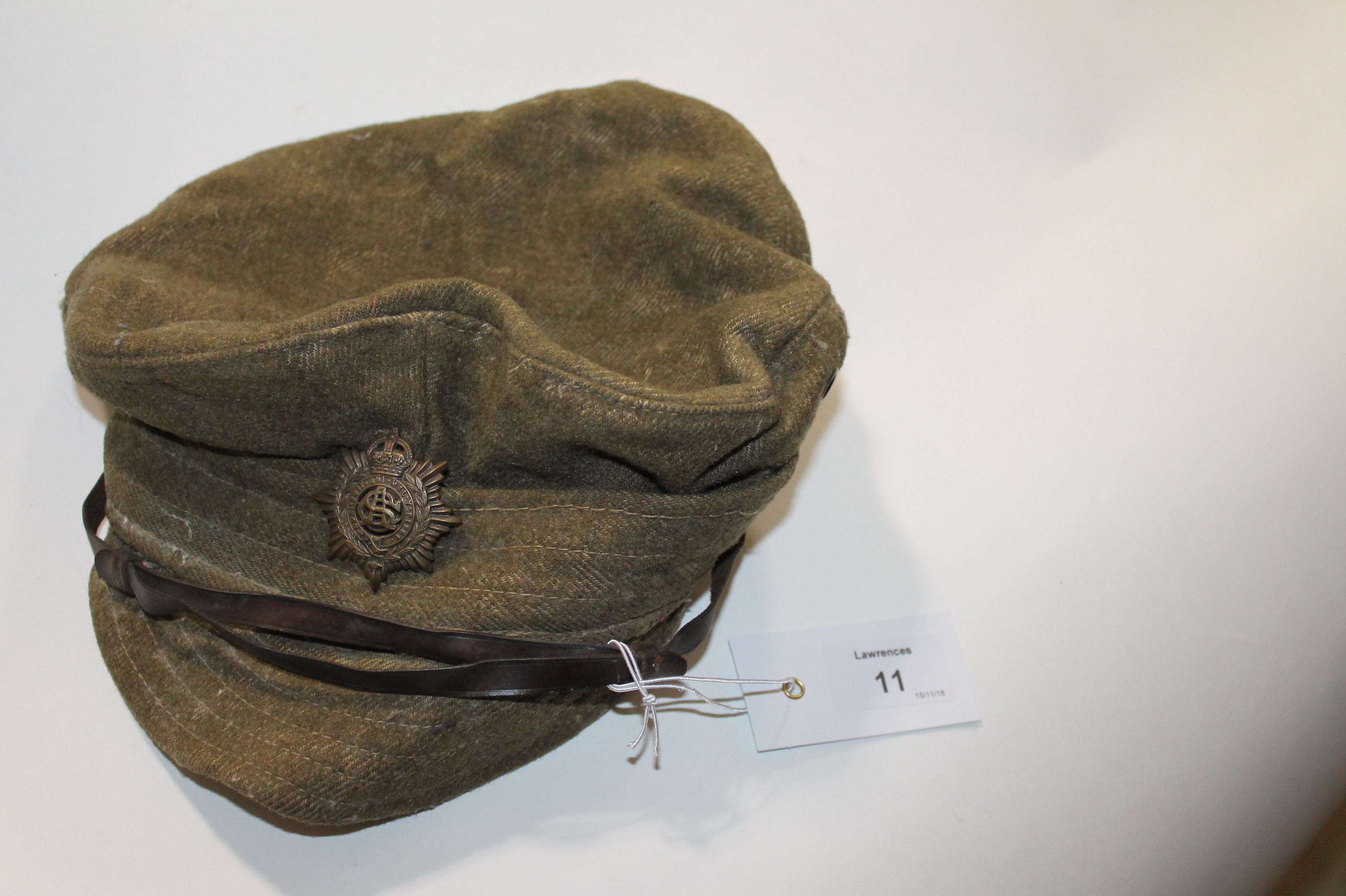 A GT WAR CAP. An other ranks soft cap of the Great War period, with ASC badge affixed. With 1915