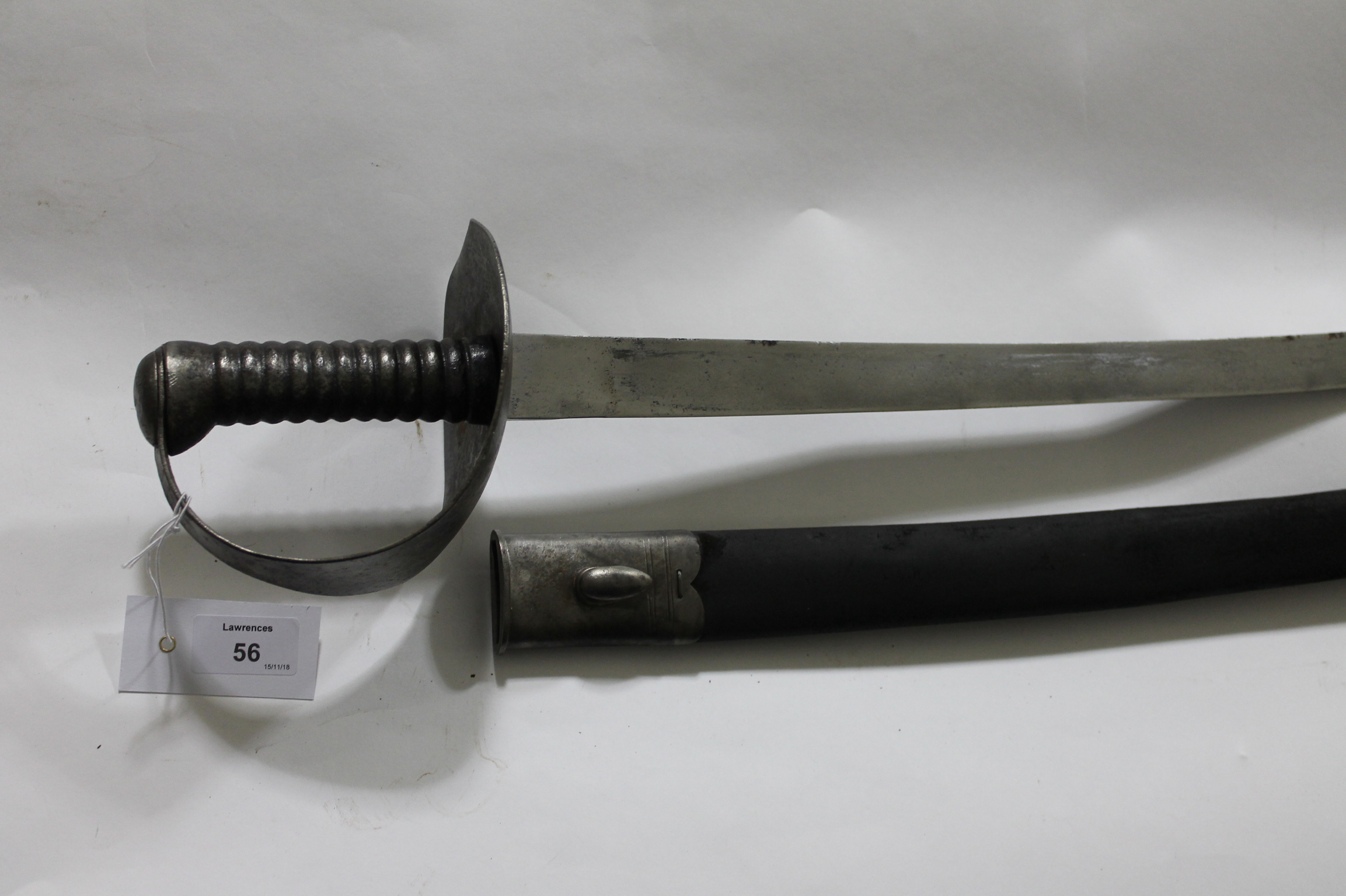 A NAVAL CUTLASS. A 19thC Naval Cutlass 1845/1858 pattern, complete with its steel and leather