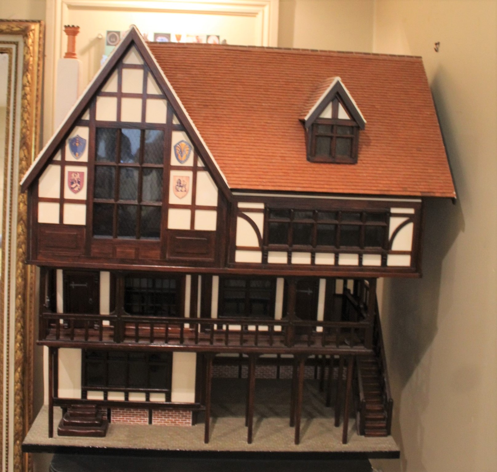 TUDOR STYLE MODERN DOLLS HOUSE & CONTENTS a modern 3 storey wooden dolls house in the Tudor style,