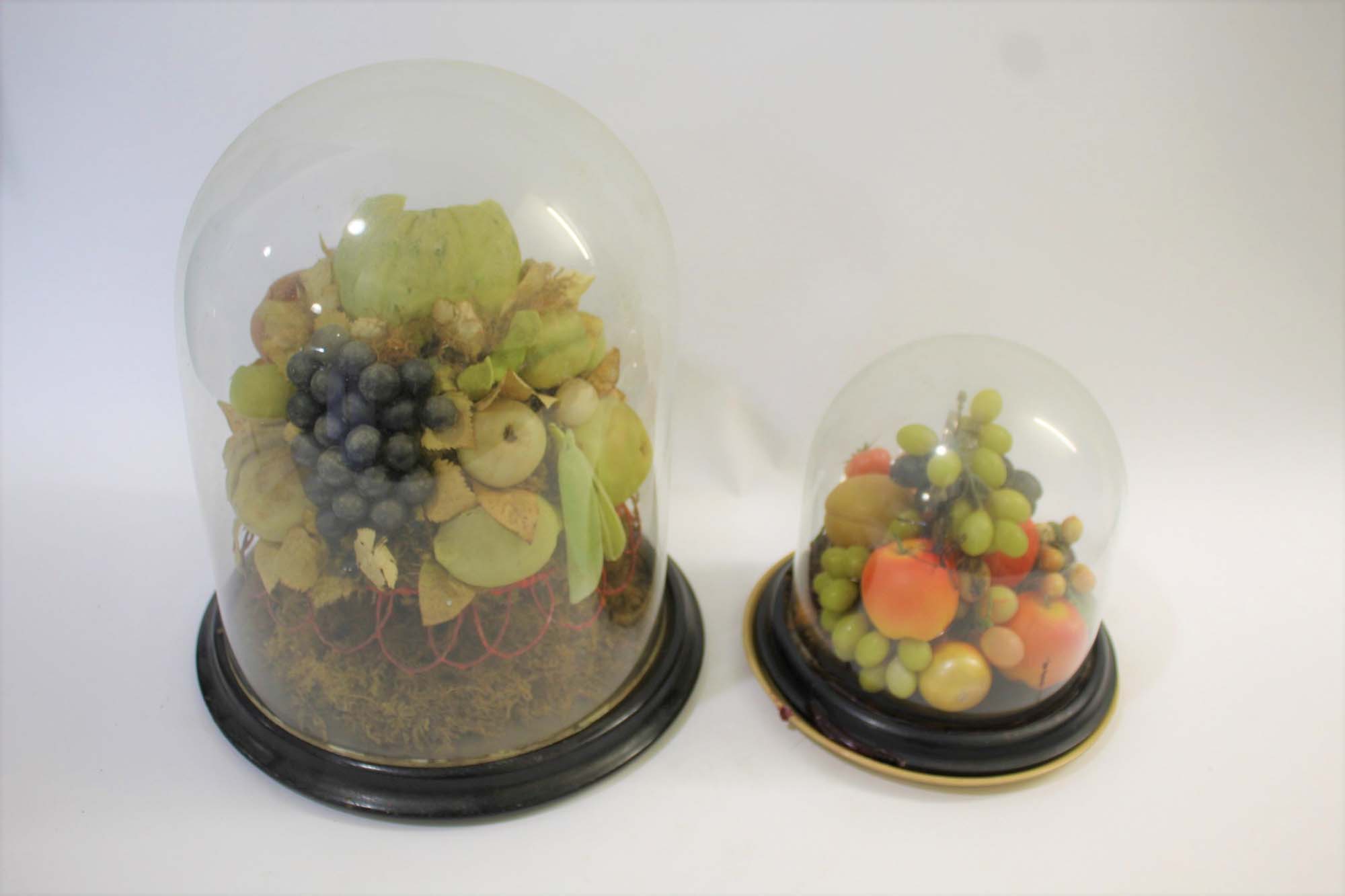 SIMULATED FRUIT & GLASS DOMES 2 large displays of simulated fruit, both with glass domes and