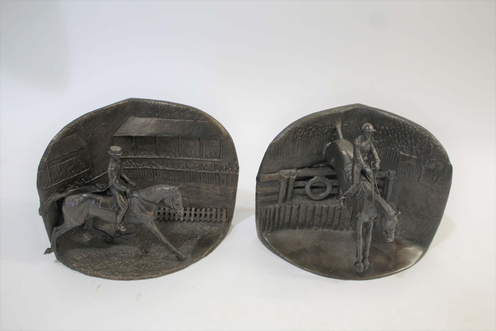 MANNER OF JUDY BOYT - BRONZE BOOKENDS Cross Country and Dressage, a pair of tableau bookends,