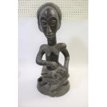 LARGE AFRICAN CARVED TRIBAL FIGURE a large carved wooden figure of a Mother and child, the Mother in