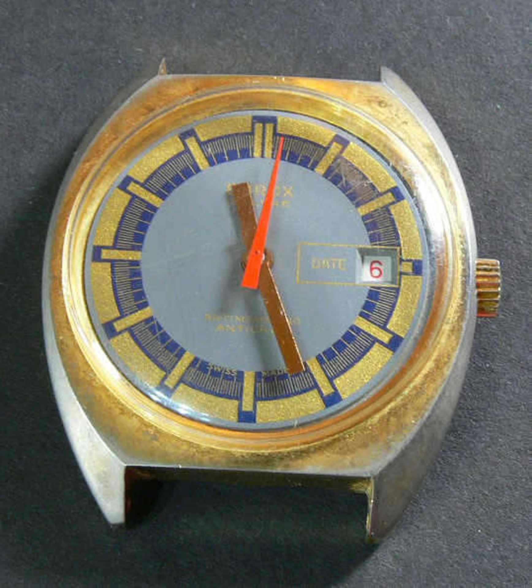 Emrox de Luxe Automatic Herrenuhr. Blau/goldenes Ziffernblatt. Datum auf der "3". Die Uhr läuft an.