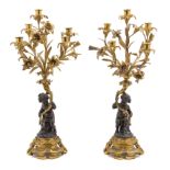 A Pair of Louis XV Style Gilt and Patinated Bronze Figural Five-Light Candelabra