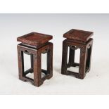 A pair of Chinese dark wood and silver wire inlaid square shaped stands, inlaid with ruyi and