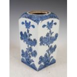 A 19th century Japanese porcelain blue and white rectangular form vase, decorated with peony, 29cm