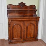 A Victorian mahogany chiffonier, the upright back with open shelf and fleur-de-lys shell and