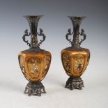A pair of Japanese white metal, enamel, lacquer and shibyama decorated hexagonal shaped twin handled