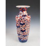 A large Japanese Imari vase, Meiji Period, the tapered cylindrical body decorated with flowers,