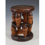 An early 20th century African Tribal carved Nigerian wood stool inscribed 'CALABAR' and dated '