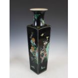 A Chinese porcelain famille noir ground vase, Qing Dynasty, decorated in shallow relief with