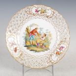 A late 19th/early 20th century Continental porcelain cabinet plate, decorated with male and female