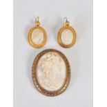A suite of late 19th century Etruscan revival yellow metal and cameo set jewellery, comprising; an