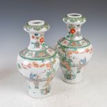 A pair of Chinese porcelain famille verte garlic neck vases, late 19th/early 20th century, decorated