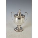 A George III silver twin handled presentation trophy cup and cover, London 1812, makers mark of