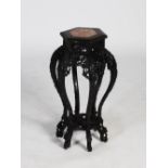 A Chinese dark wood hexagonal shaped jardiniere stand, Qing Dynasty, the hexagonal shaped top with a
