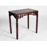 A Chinese dark wood centre table, the panelled rectangular top above a pierced scroll carved frieze,