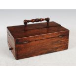 An early 19th century rosewood desk stand, of rectangular form with turned carrying handle and two