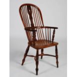 A yew wood and ash Windsor armchair, 110cm high.