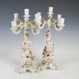 A pair of late 19th/early 20th century Continental porcelain five light floral encrusted candelabra,