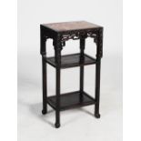 A Chinese dark wood jardiniere stand, Qing Dynasty, the rectangular top with a mottled red and white