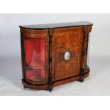 A Victorian burr walnut, gilt metal and porcelain mounted credenza, the shaped top above a central