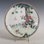 A Chinese porcelain famille rose dish, Republican Period, decorated with fenced garden of rockwork