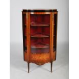 An early 20th century Louis XV style kingwood, marquetry and gilt metal mounted corner vitrine,