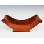 A 19th century mahogany cheese coaster, 39.5cm wide x 13.5cm high x 19.5cm deep.