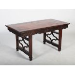 A Chinese dark wood centre table, Qing Dynasty, the panelled rectangular top above a frieze carved