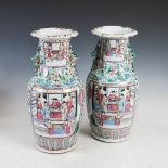 A pair of Chinese porcelain famille rose Canton vases, Qing Dynasty, decorated with rectangular