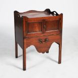 A George III mahogany tray top commode, the rectangular top with raised gallery edge and two