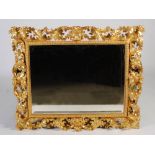 A 19th century Florentine gilt wood wall mirror, the bevelled rectangular mirror plate within a