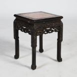 A Chinese dark wood jardiniere stand, Qing Dynasty, the square top with a mottled red and white