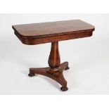 A 19th century rosewood pedestal tea table, the rounded rectangular top above a plain frieze, raised