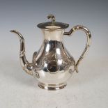 A Chinese silver coffee pot, makers mark of KMS, Qing Dynasty, with embossed decoration of dragon