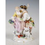 A Meissen porcelain figure group, modelled with girl holding a basket of vines with attendant male