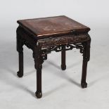 A Chinese dark wood jardiniere stand, Qing Dynasty, the square shaped top with a mottled red and