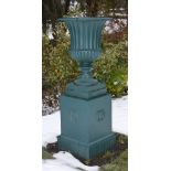 A late 19th/early 20th century green painted cast iron garden urn, formed in two sections, 149cm