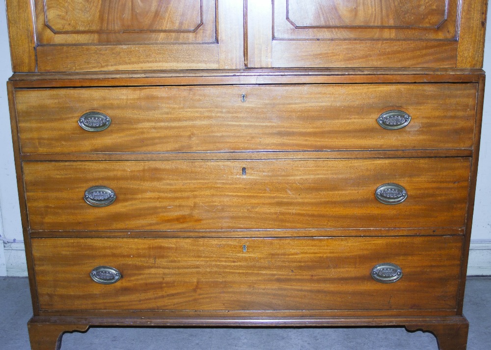 A 19th century mahogany linen press, the moulded cornice and dentil frieze above a pair of - Image 3 of 7